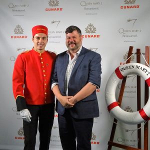 Kevin Grubb of Q Cruise + Travel with Cunard bell boy